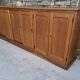Oak workshop furniture with sliding doors.
