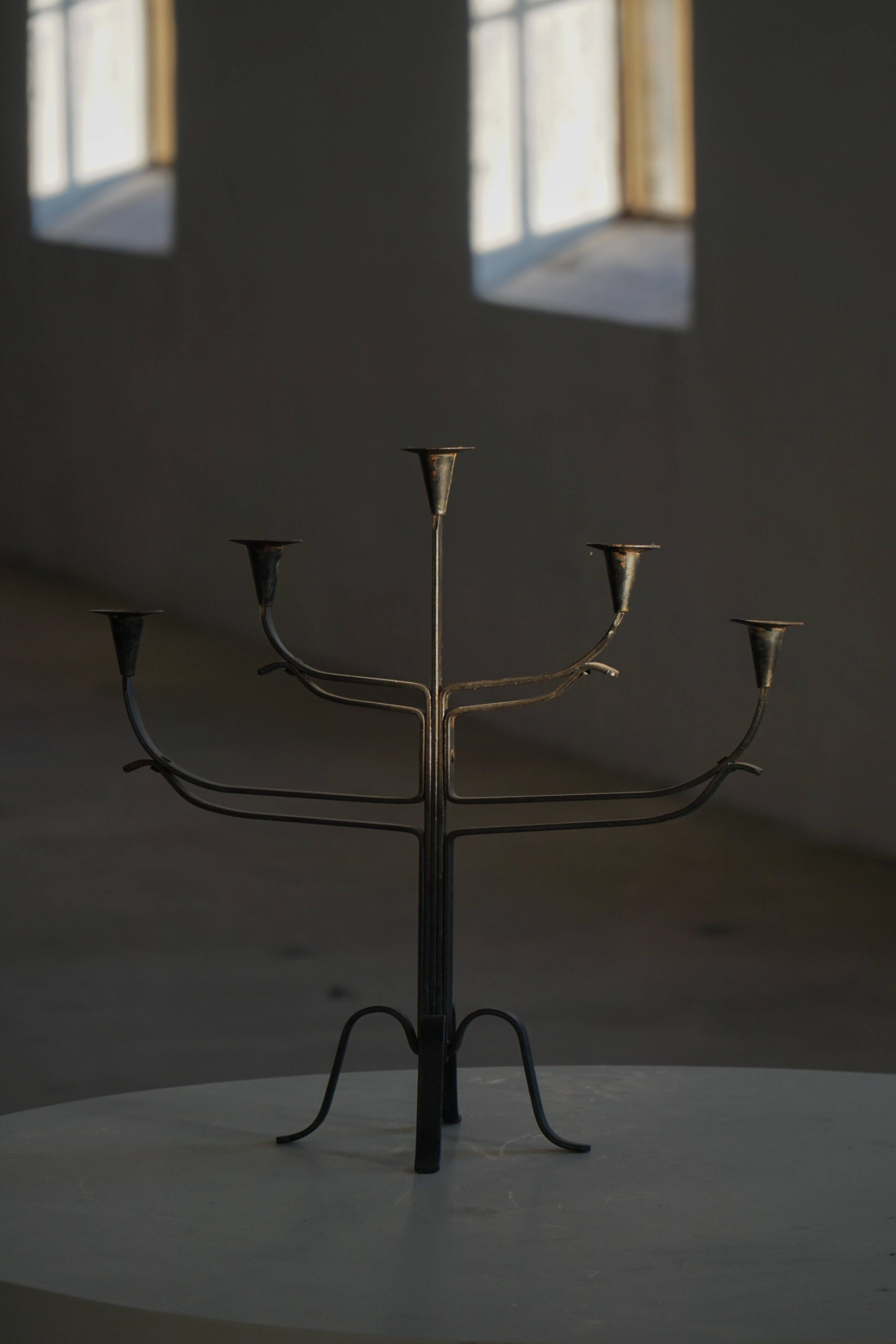 Brutalist Scandinavian candlestick in wrought iron and metal from the mid-20th century.