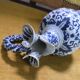Fine earthenware jug with blue and white decoration, 19th-century work.