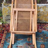 Cane folding armchair in solid wood