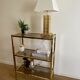 VINTAGE SHELF CONSOLE IN GOLD METAL AND SMOKED GLASS