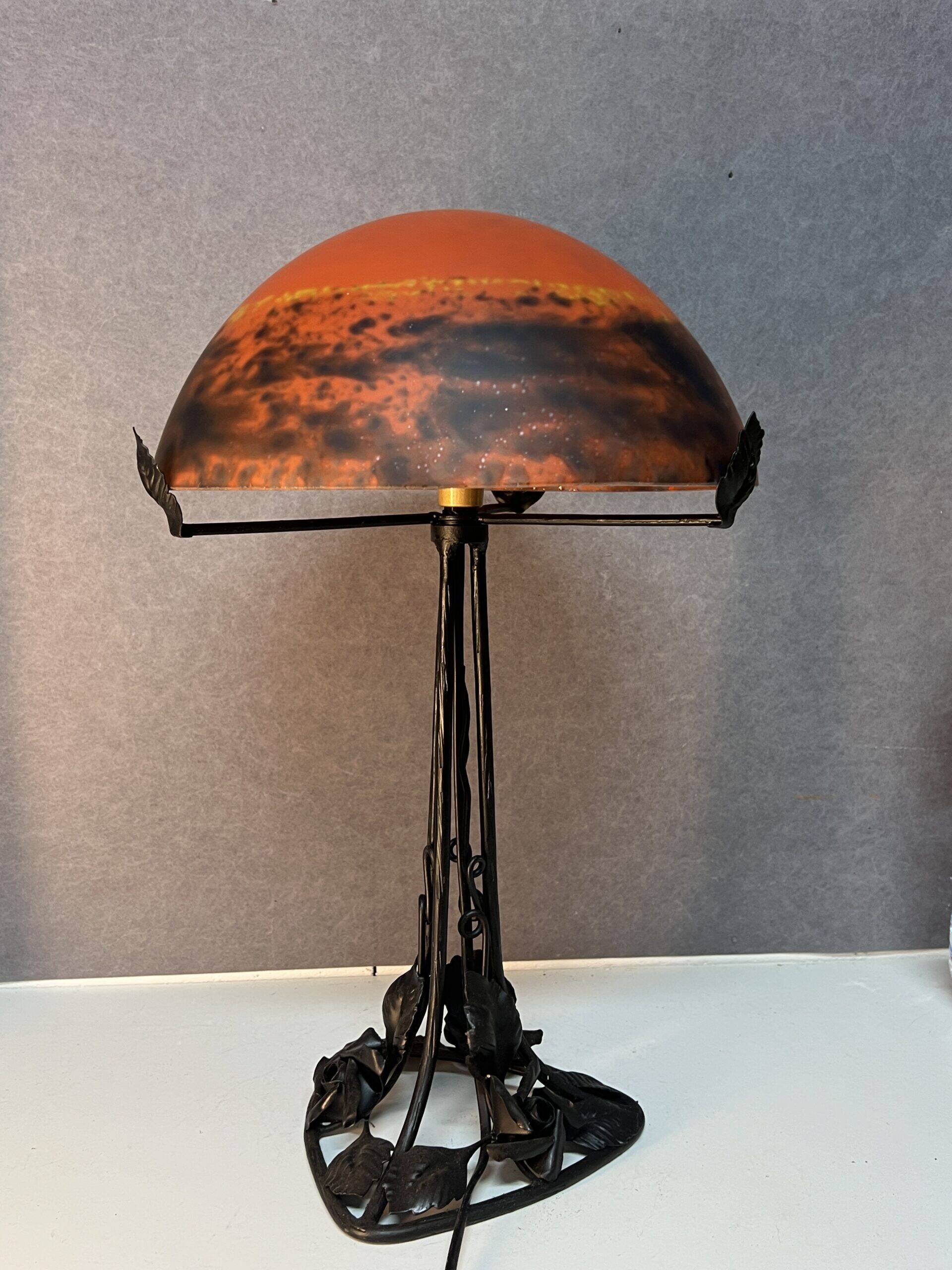 Contemporary mushroom lamp, wrought iron base and shaded orange glass shell