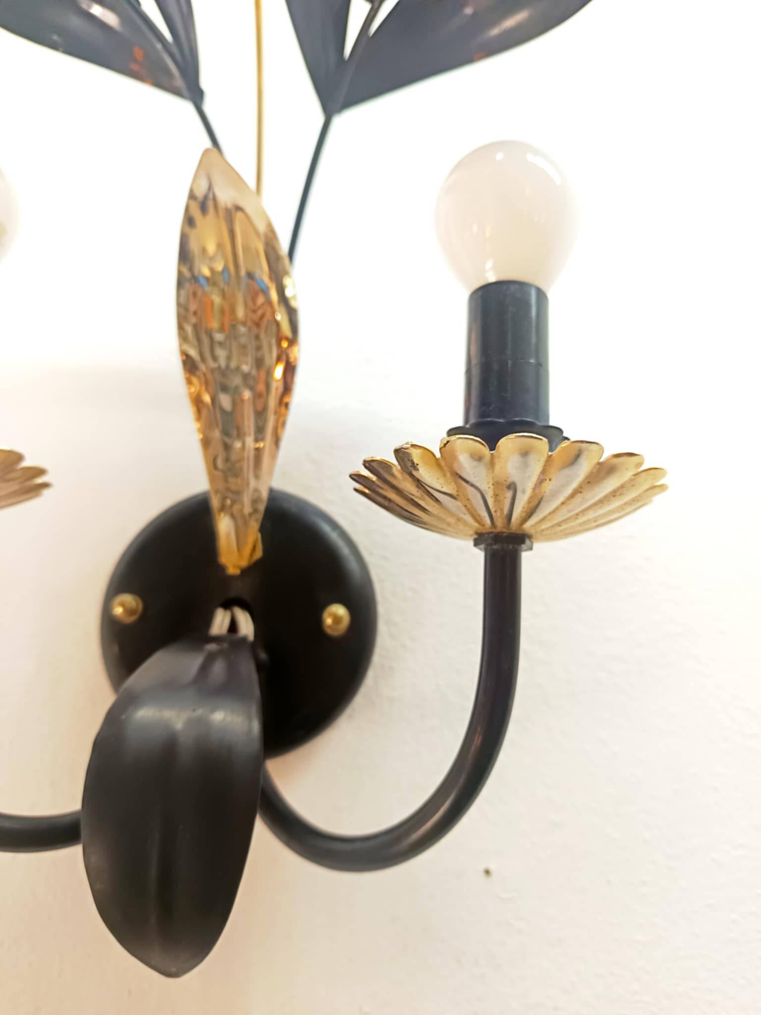 Black and gold Hollywood Regency leaf wall sconce