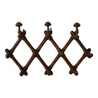Turned wood wall coat rack