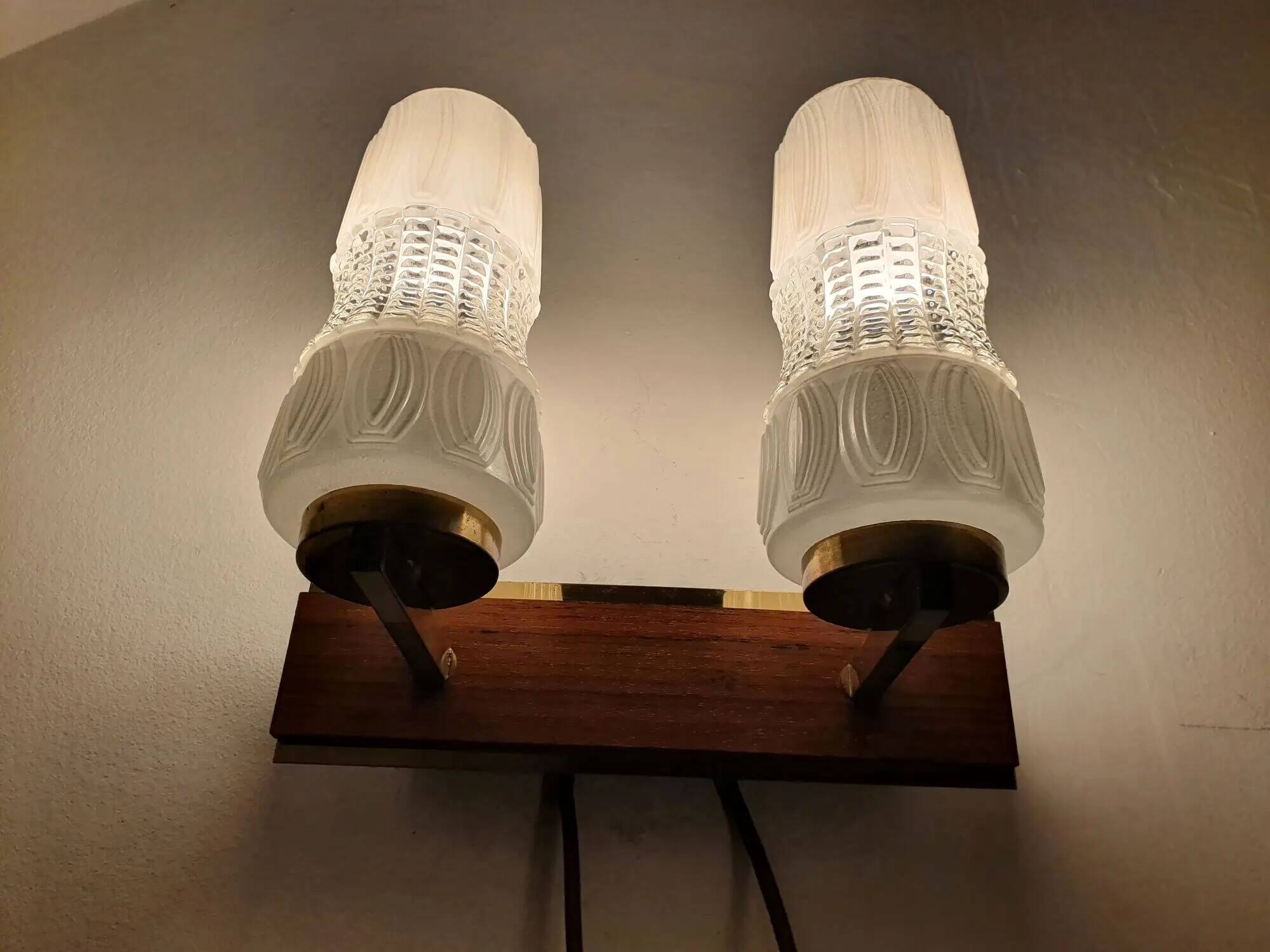 Vintage gold wall light on wooden stand