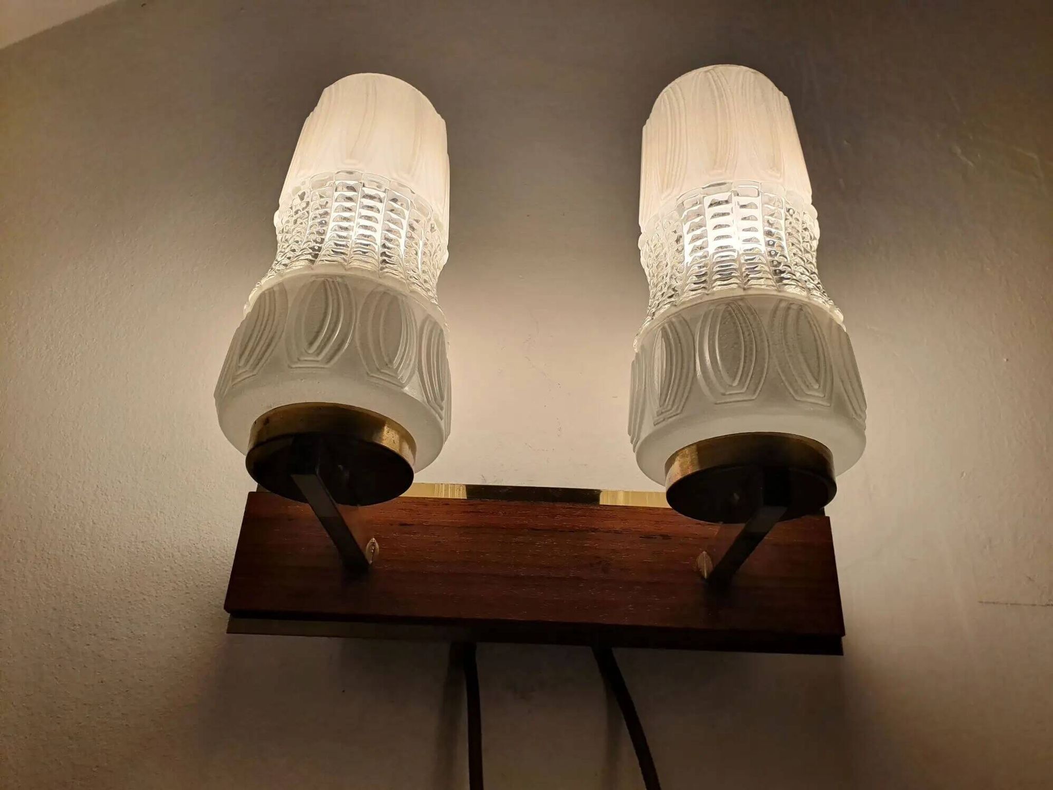 Vintage gold wall light on wooden stand