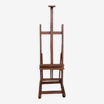 Solid oak painter's easel with vintage rack