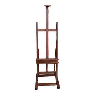 Solid oak painter's easel with vintage rack