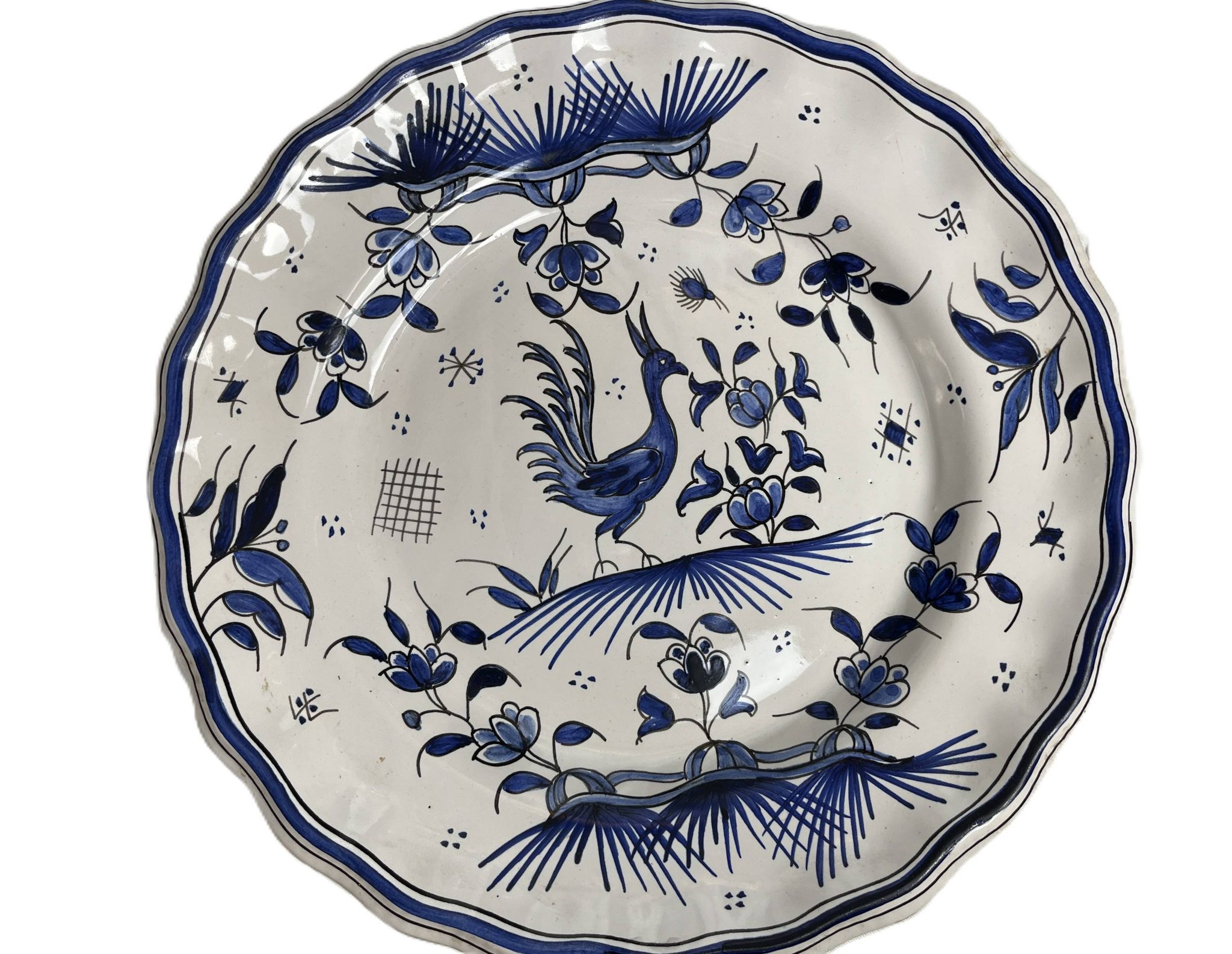 Moustiers, pairs of plates with wading bird design, scalloped edge, early 20th century.