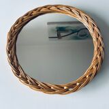 Round mirror in vintage wicker