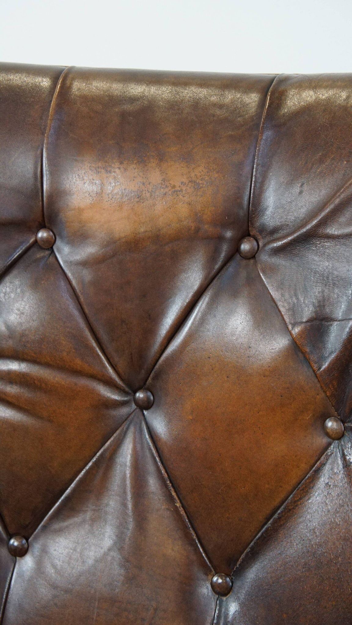 Vintage sheepskin armchair in a dark cognac colour with a comfortable seat