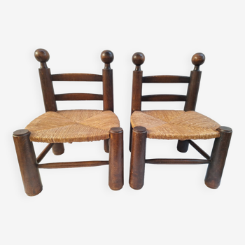 Pair of low chairs by Charles Dudouyt