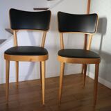 5 baumann chairs with large backs in black faux leather.