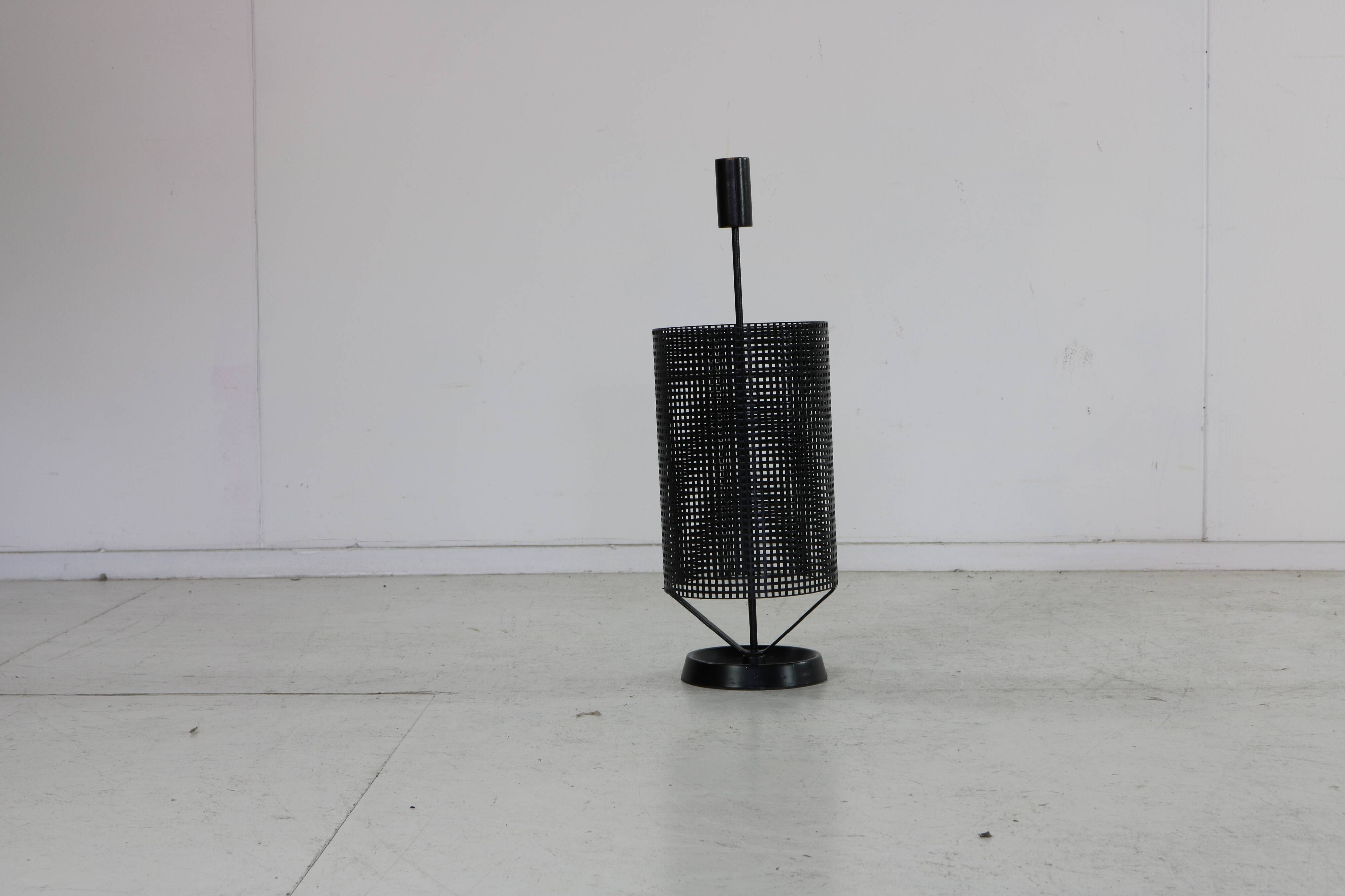 Minimalistic dutch design perforated metal umbrella stand