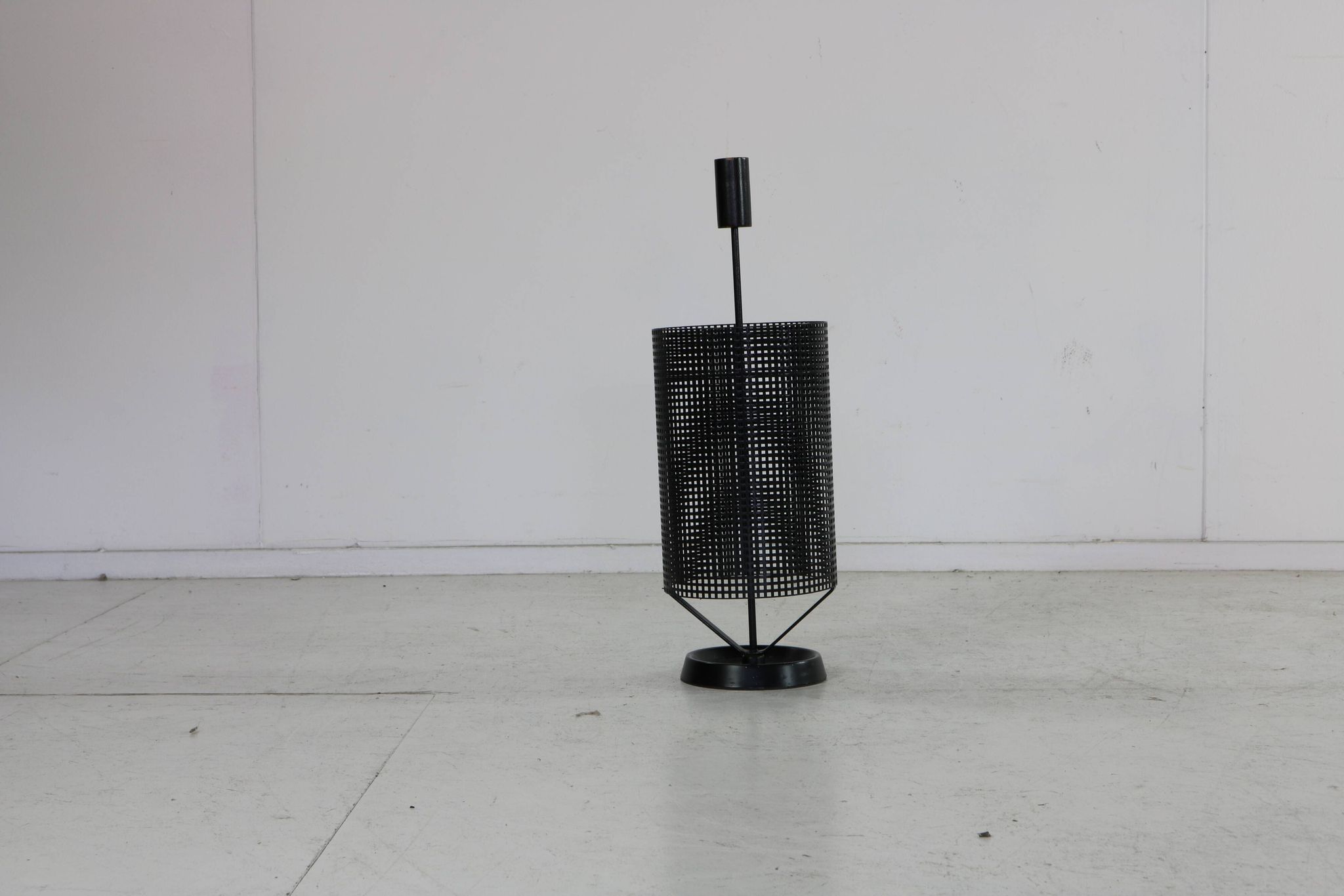 Minimalistic dutch design perforated metal umbrella stand