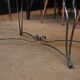 Table basse metal perforé pied fer forgé 1940