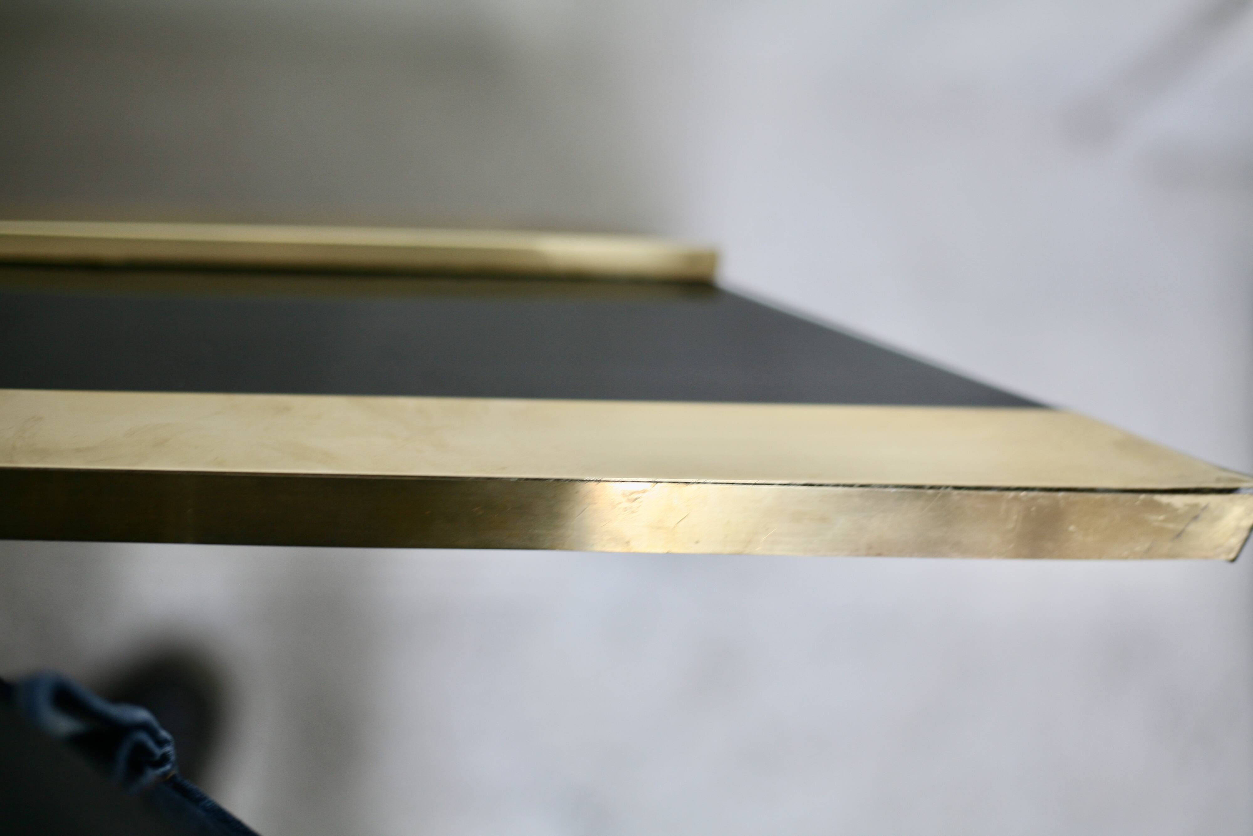 Jean-Claude Mahey mirror. Black lacquered wood and gold metal. 1970