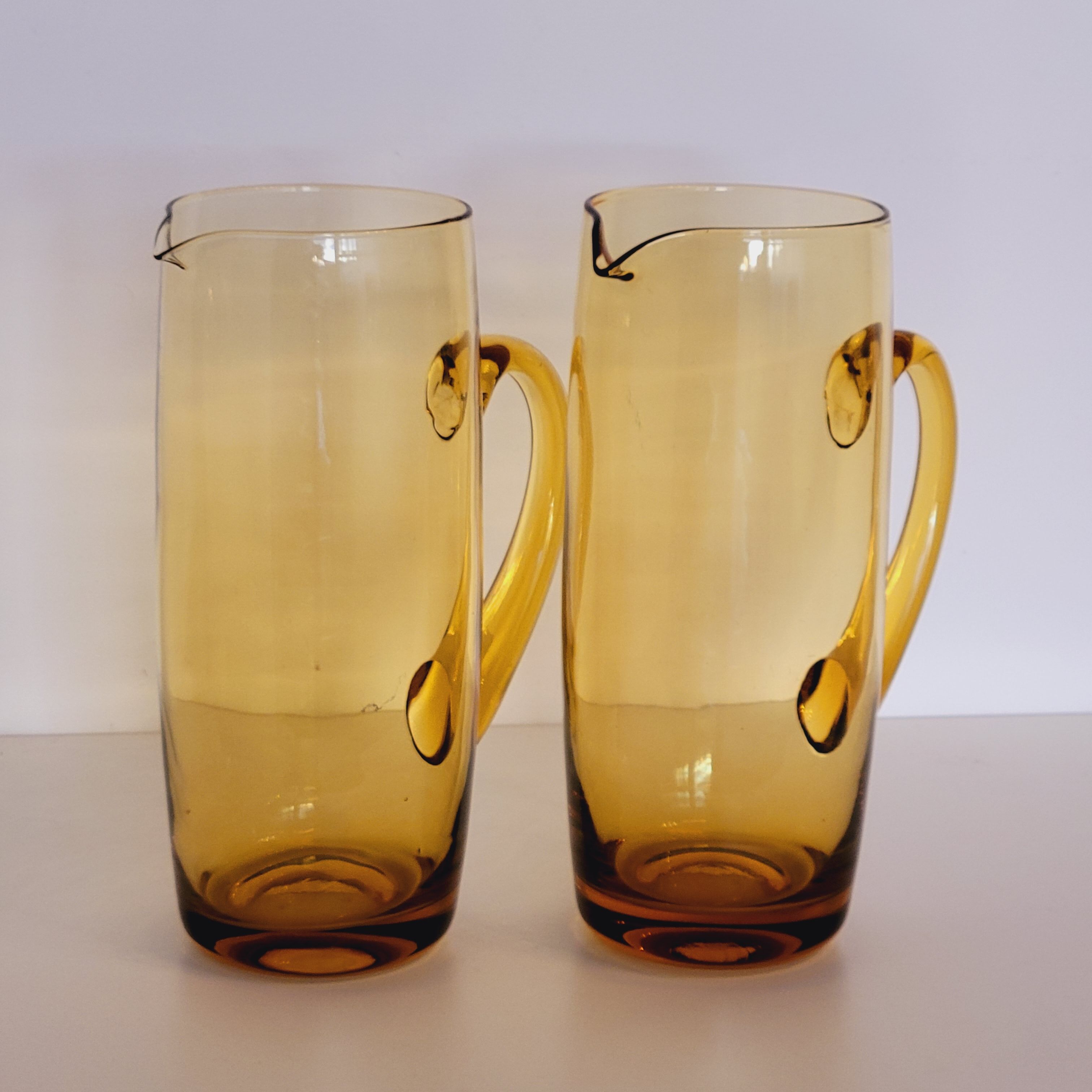 2 carafes in vintage amber yellow blown glass