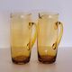 2 carafes in vintage amber yellow blown glass
