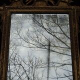 Louis XVI period mirror in gilded carved wood
