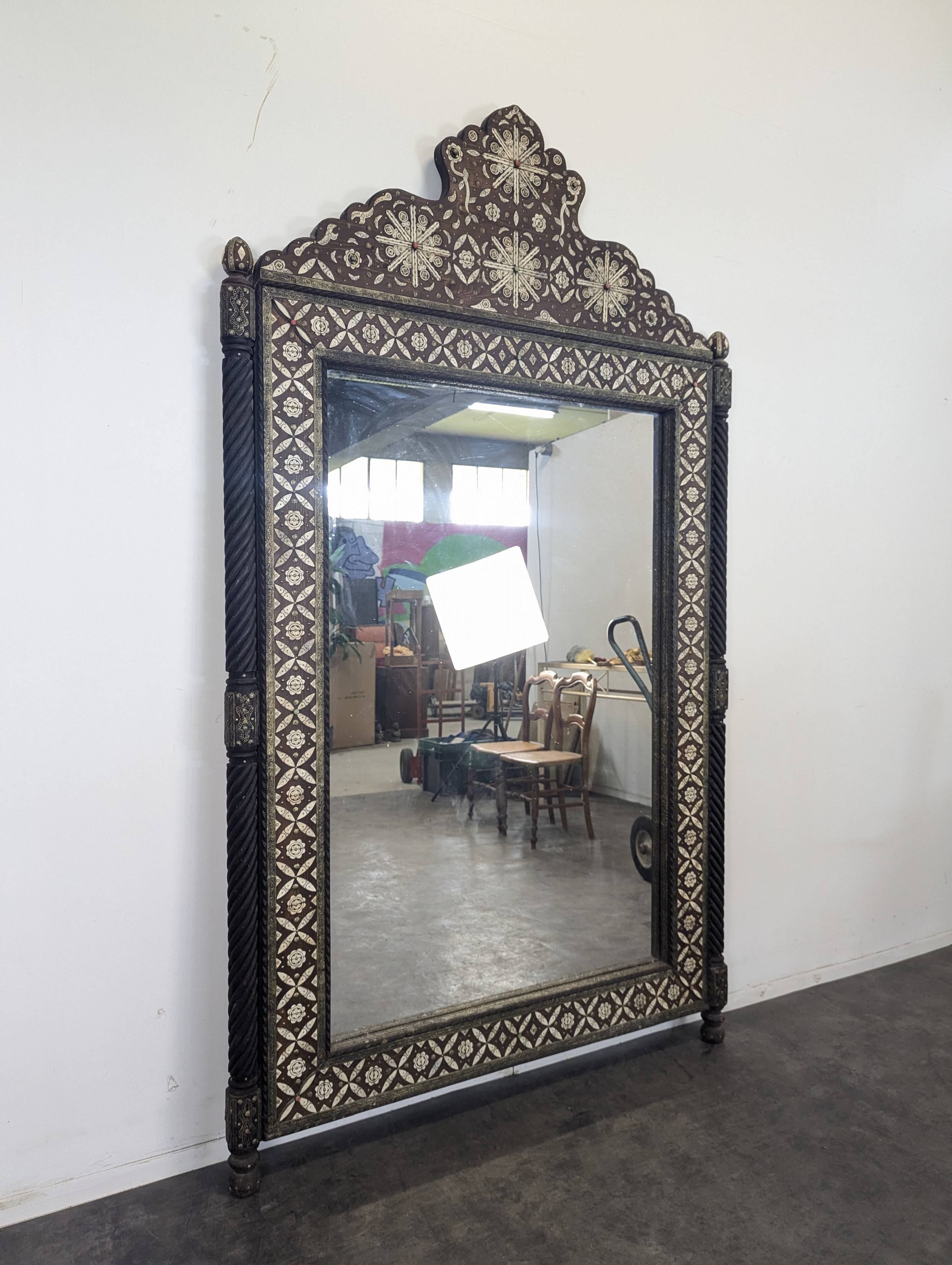 Orientalist mirror with bone inlays and hard stone cabochons.