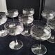 8 vintage glass champagne coupes with an engraved frieze decoration.