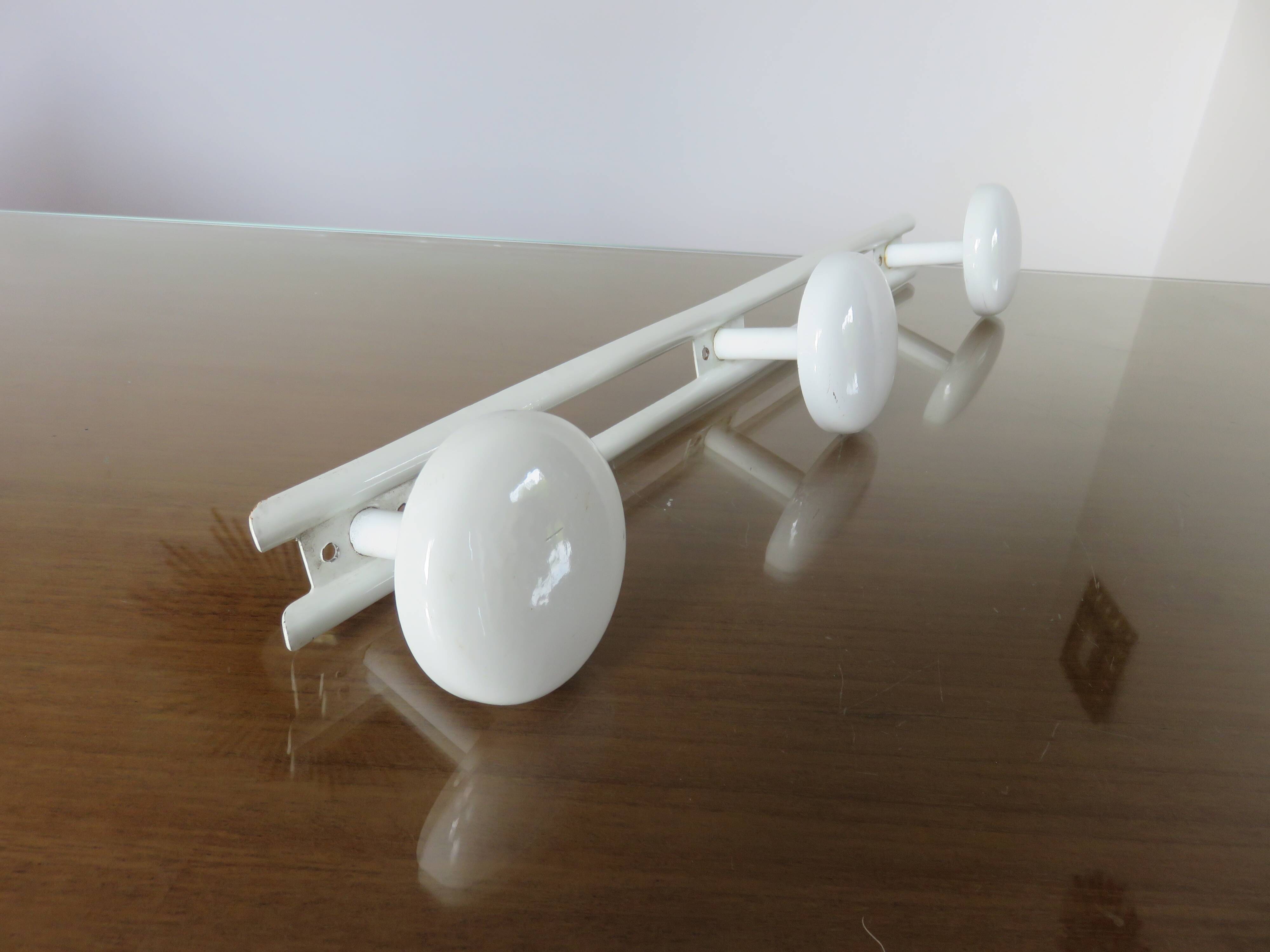 White lacquered metal wall coat rack with 3 hooks, 1970.