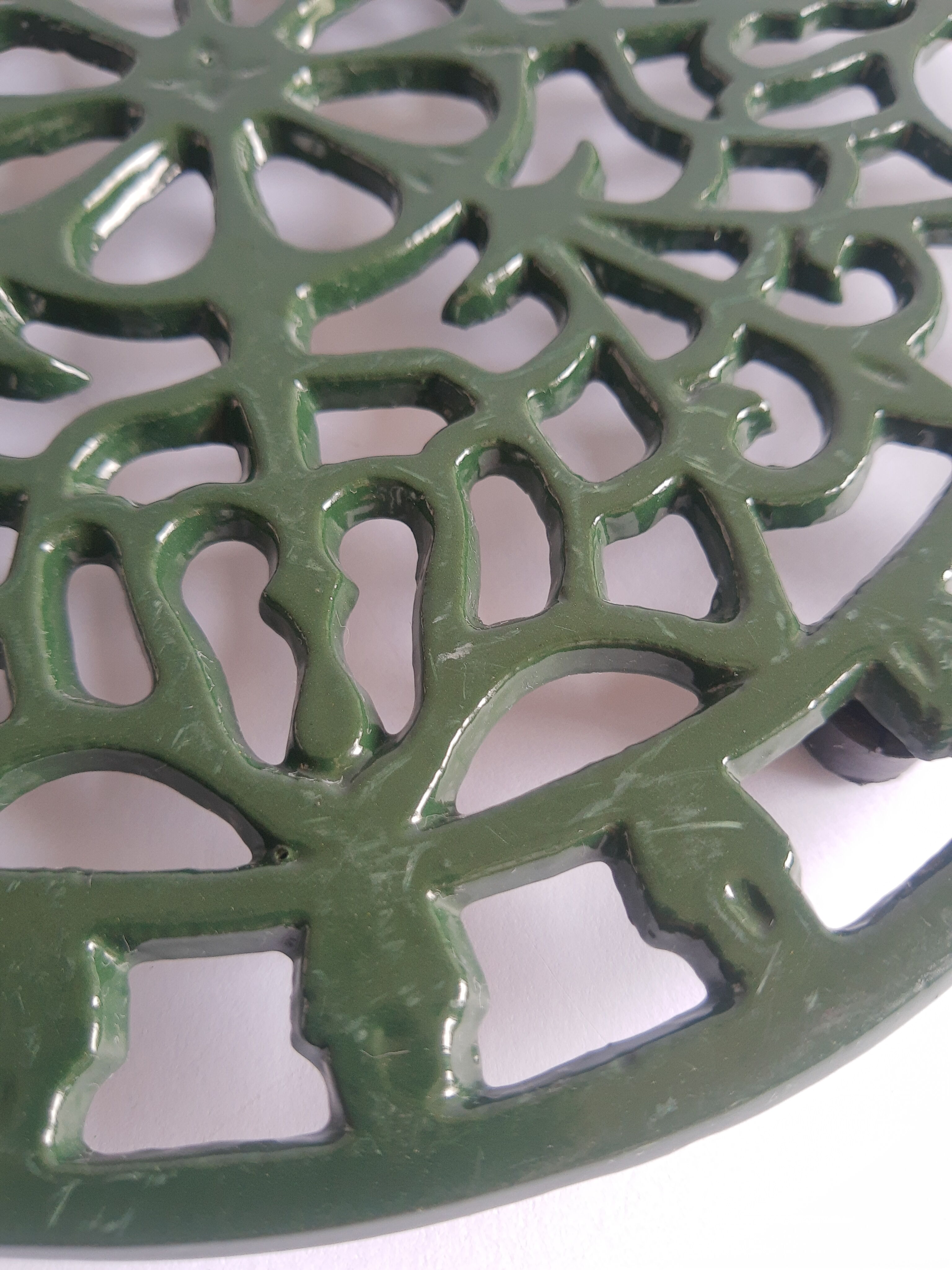 Vintage green cast iron trivet