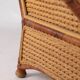 Large wicker armchair and its ottoman