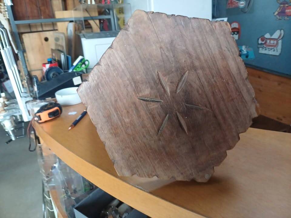 Vintage tripod stool in carved solid wood.