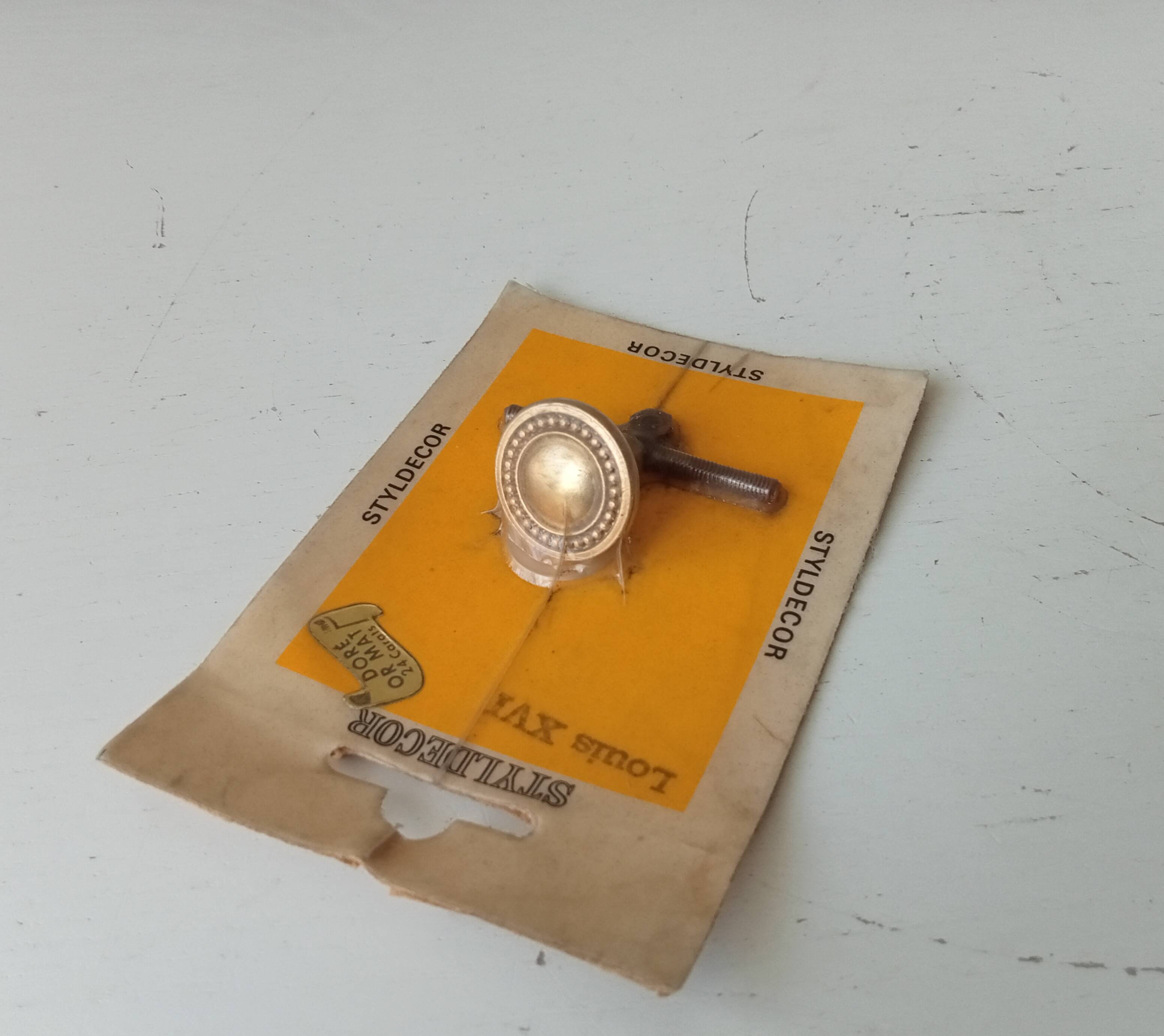 Vintage furniture knob in Louis XVI style, gilded with fine gold.