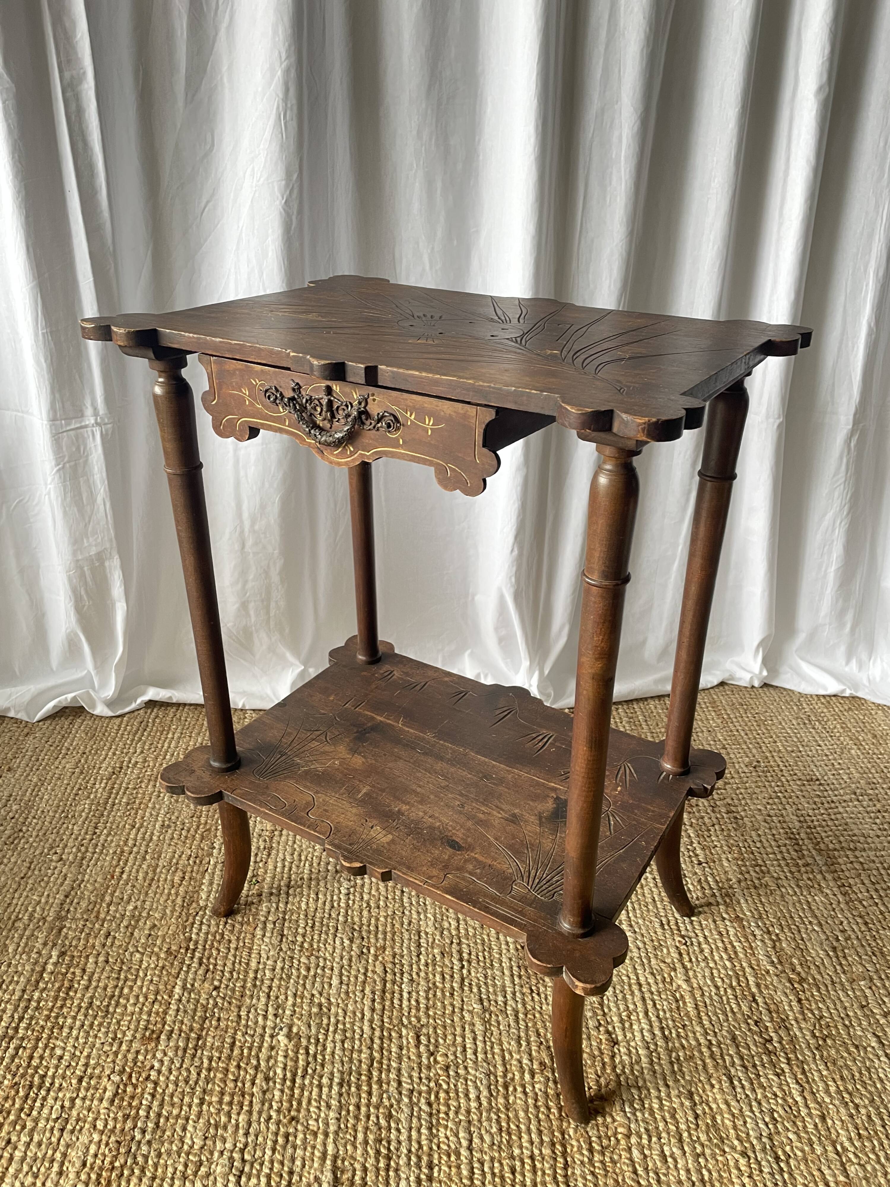 Elegant Art Nouveau side table in walnut, France early 20th century.