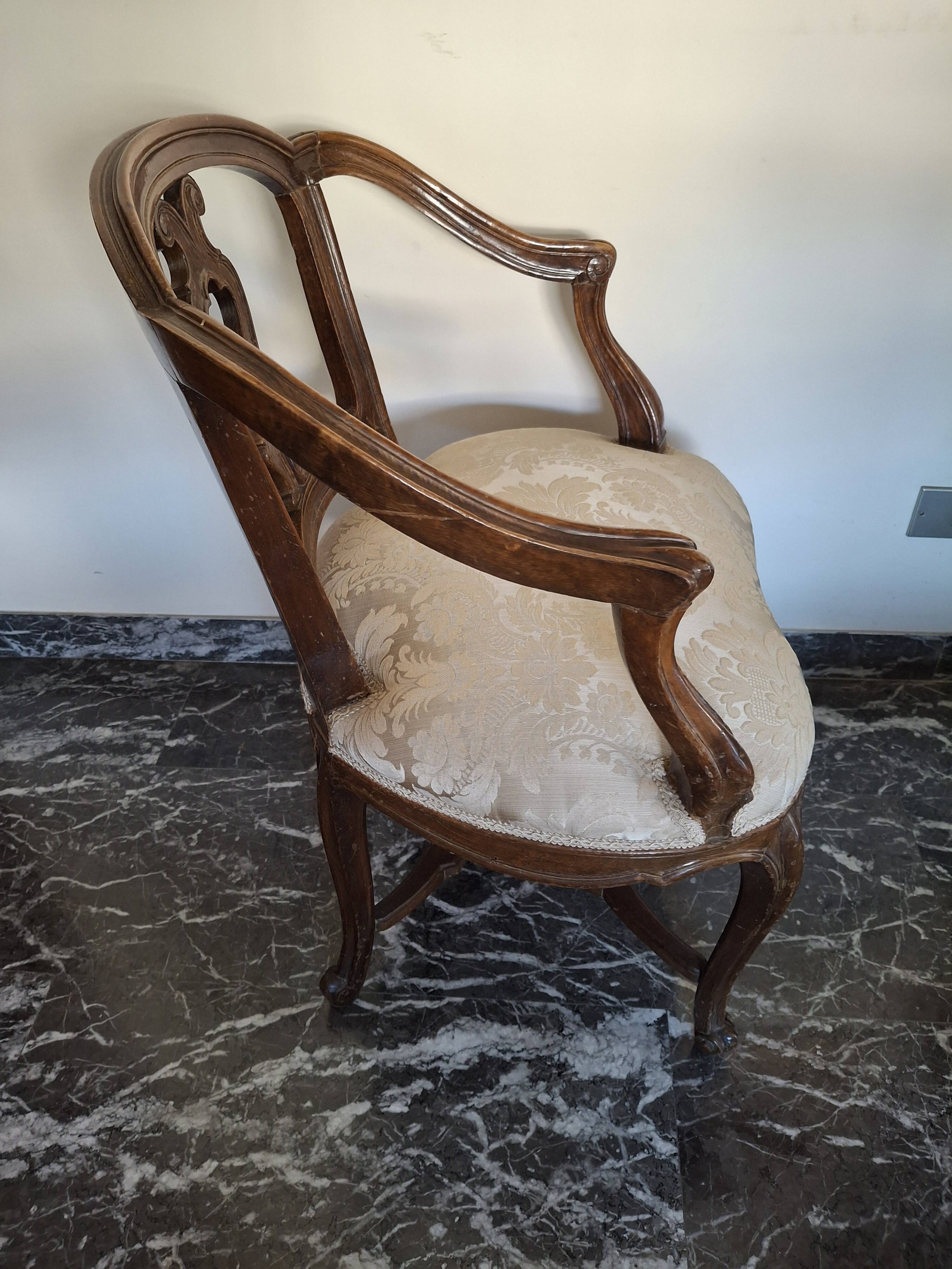 Pair of Italian armchairs from the 1960s with matching ottoman.