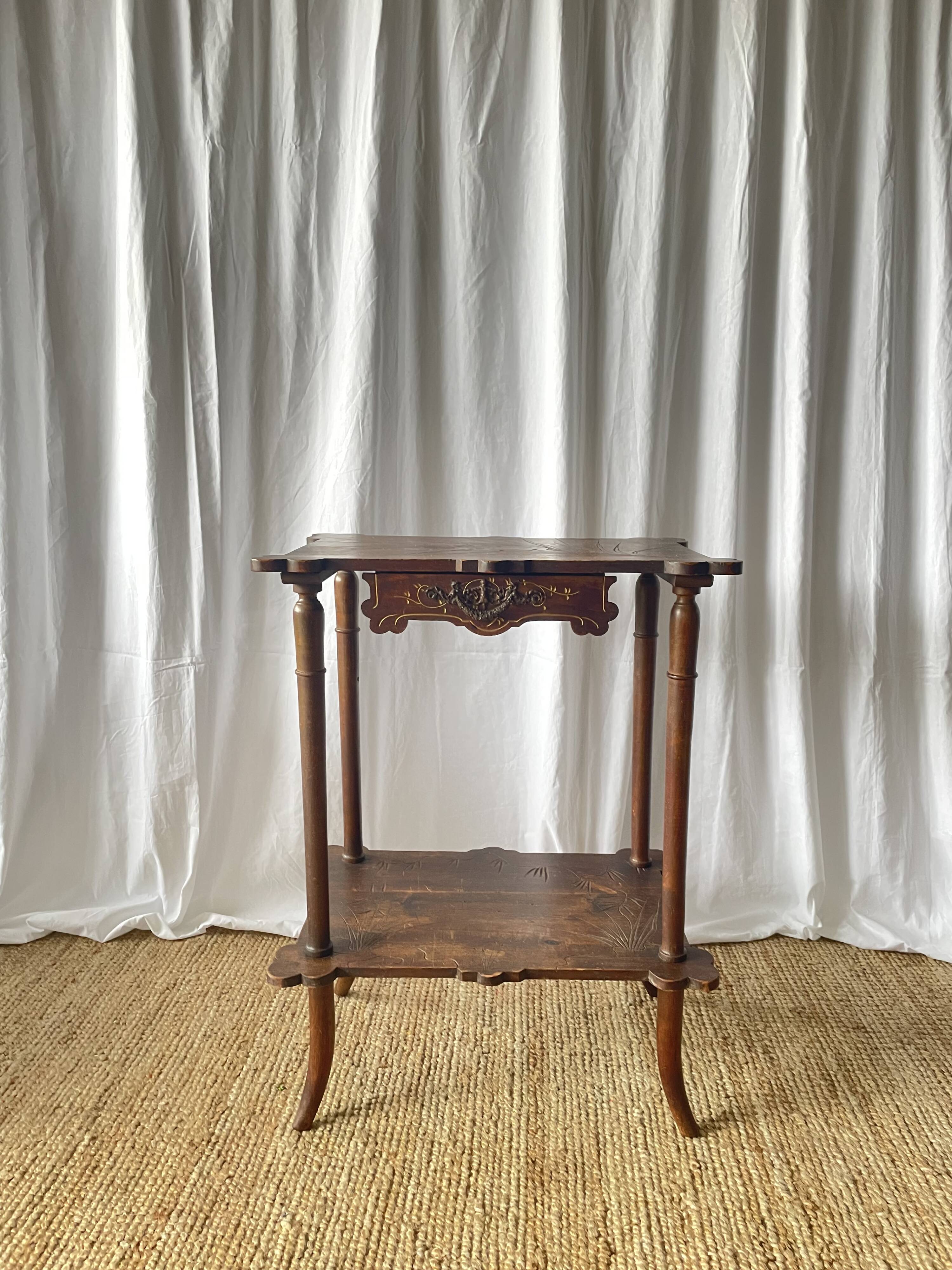 Elegant Art Nouveau side table in walnut, France early 20th century.