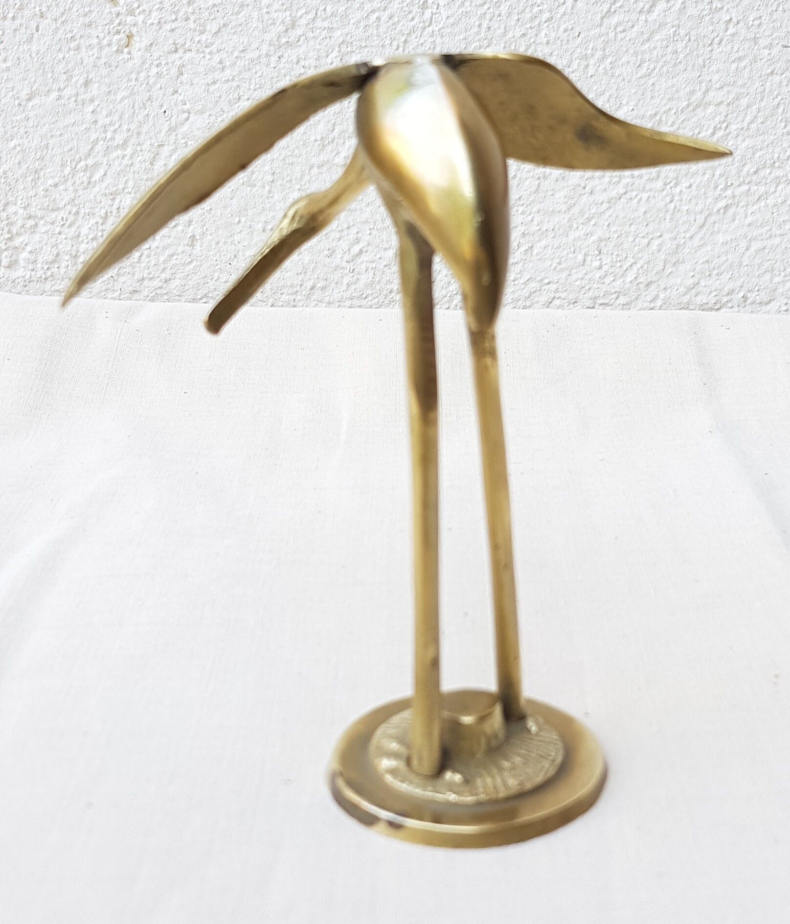 Small brass heron
