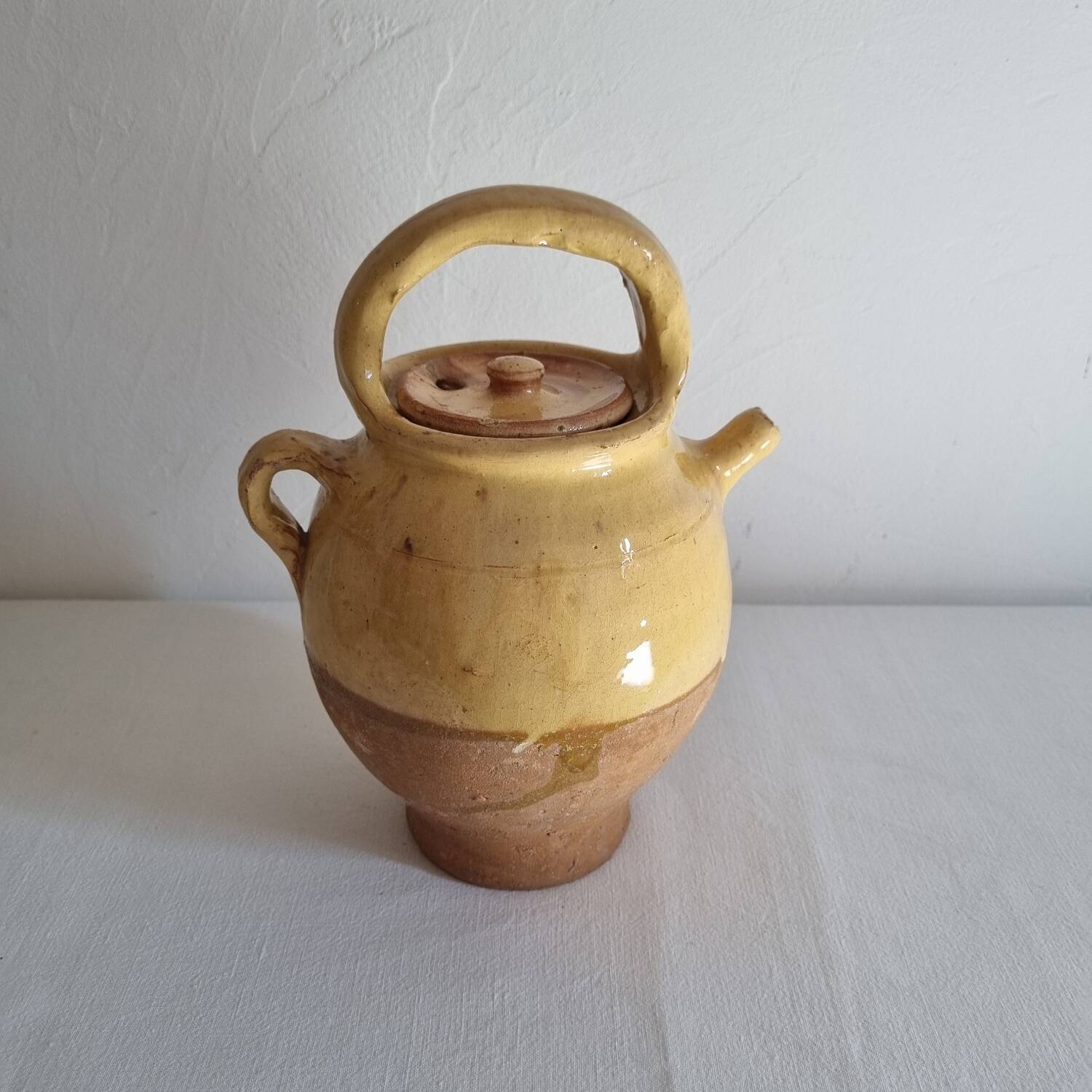 Glazed terracotta jug with lid