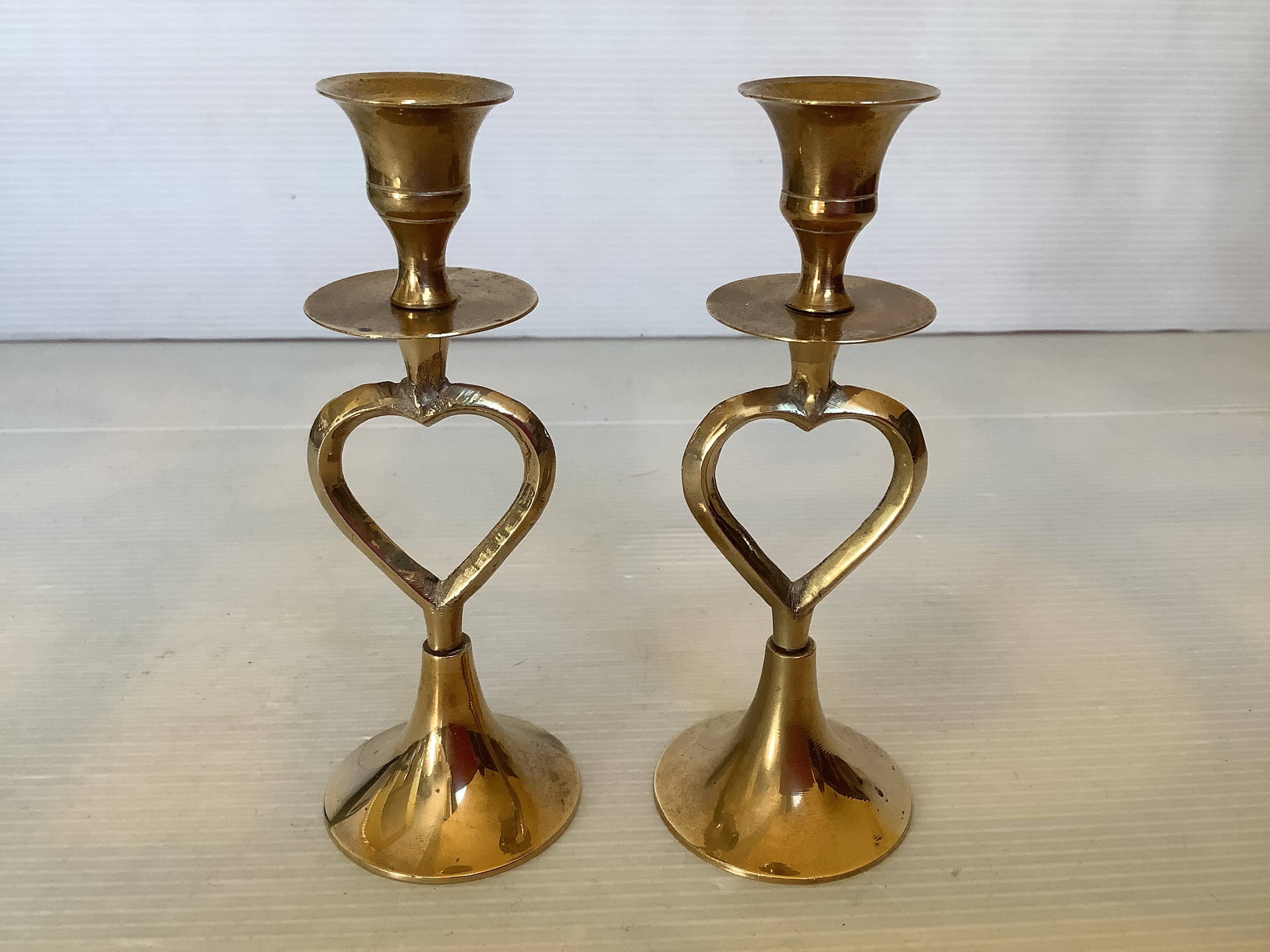 Pair of small brass heart candlesticks