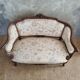 Small sofa or bench in Louis XV style, rococo.