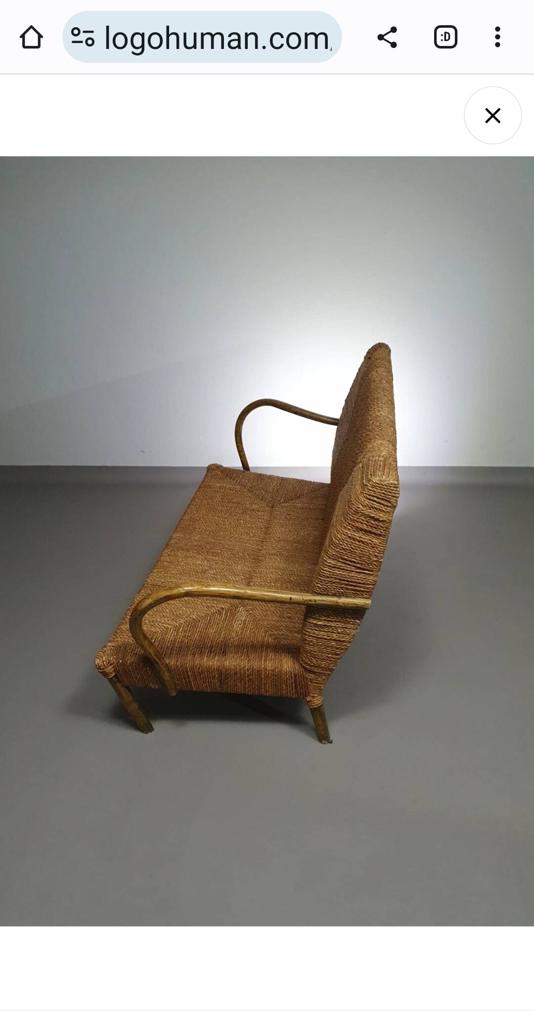 Vintage French papercord sofa with a metal frame base