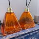 Set of two amber glass hanging lamps