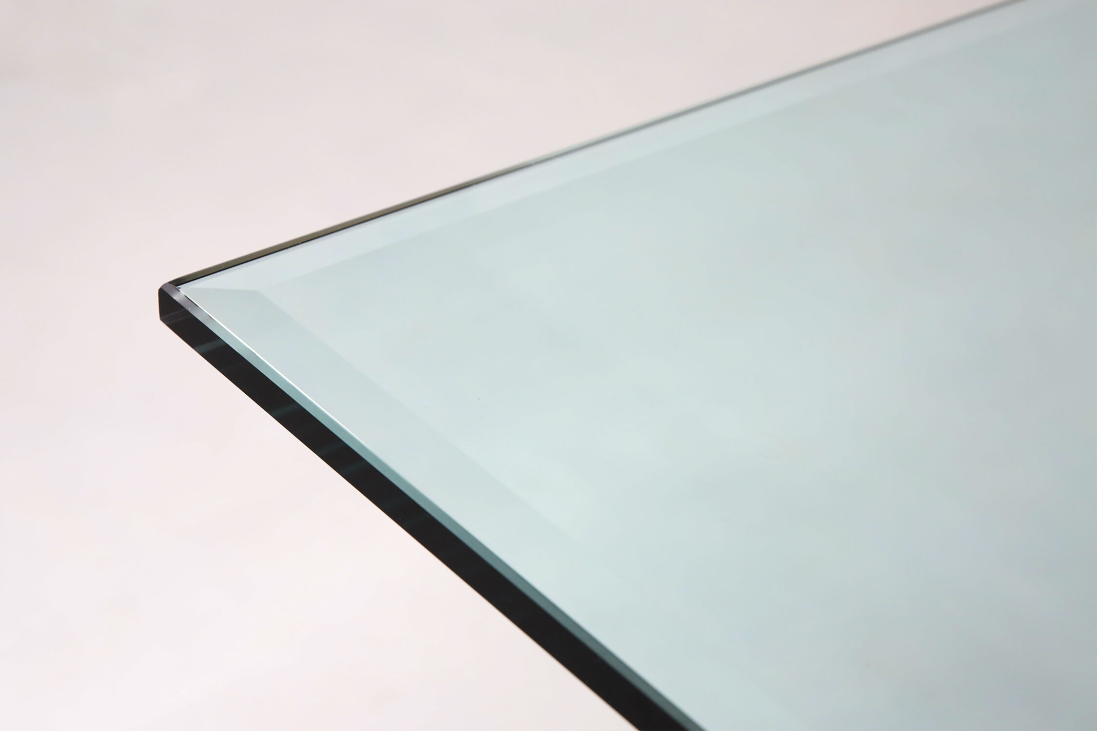 Belgo Chrom dining table in brushed stainless steel and glass top