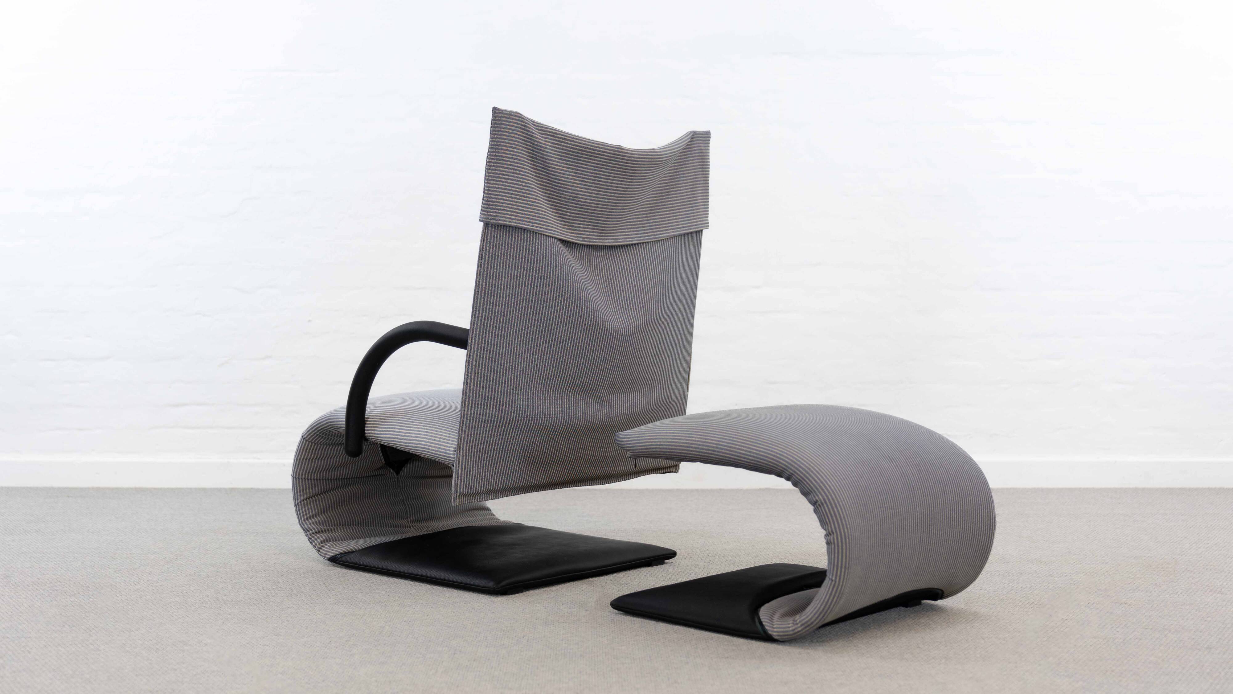 Zen easy chair with footrest by claude brisson for ligne roset
