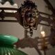 Antique adjustable height chandelier with original glasswork and brass detailing