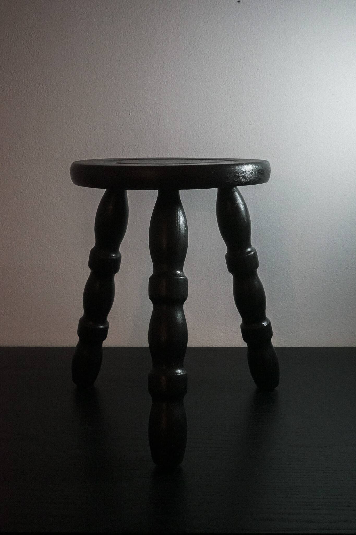 The small tripod in burnt oak wood