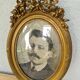 Antique medallion frame in gilded stucco with its period portrait.