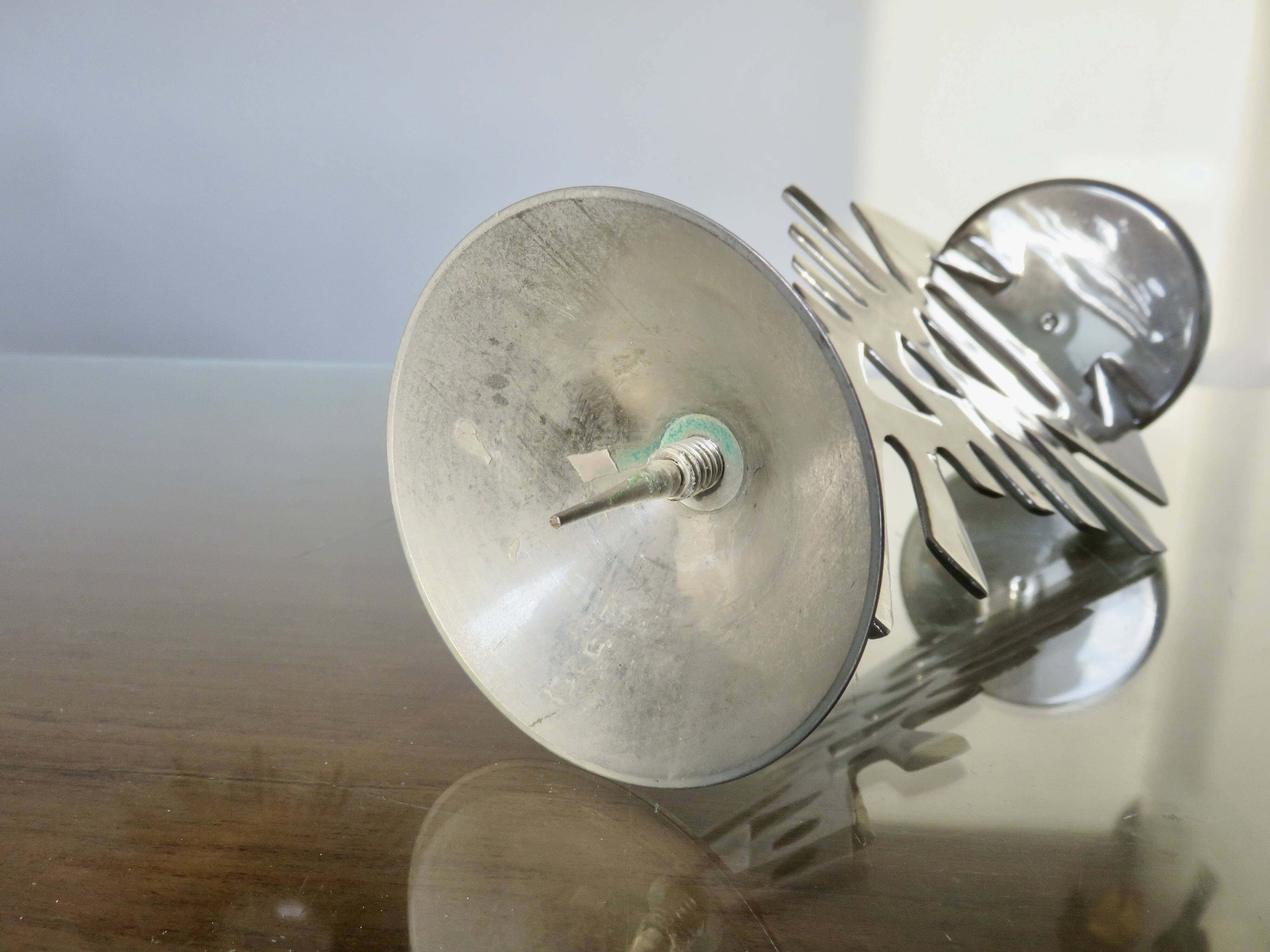 Ethnic “skeleton” candle holder in nickel-plated brass from the 80s