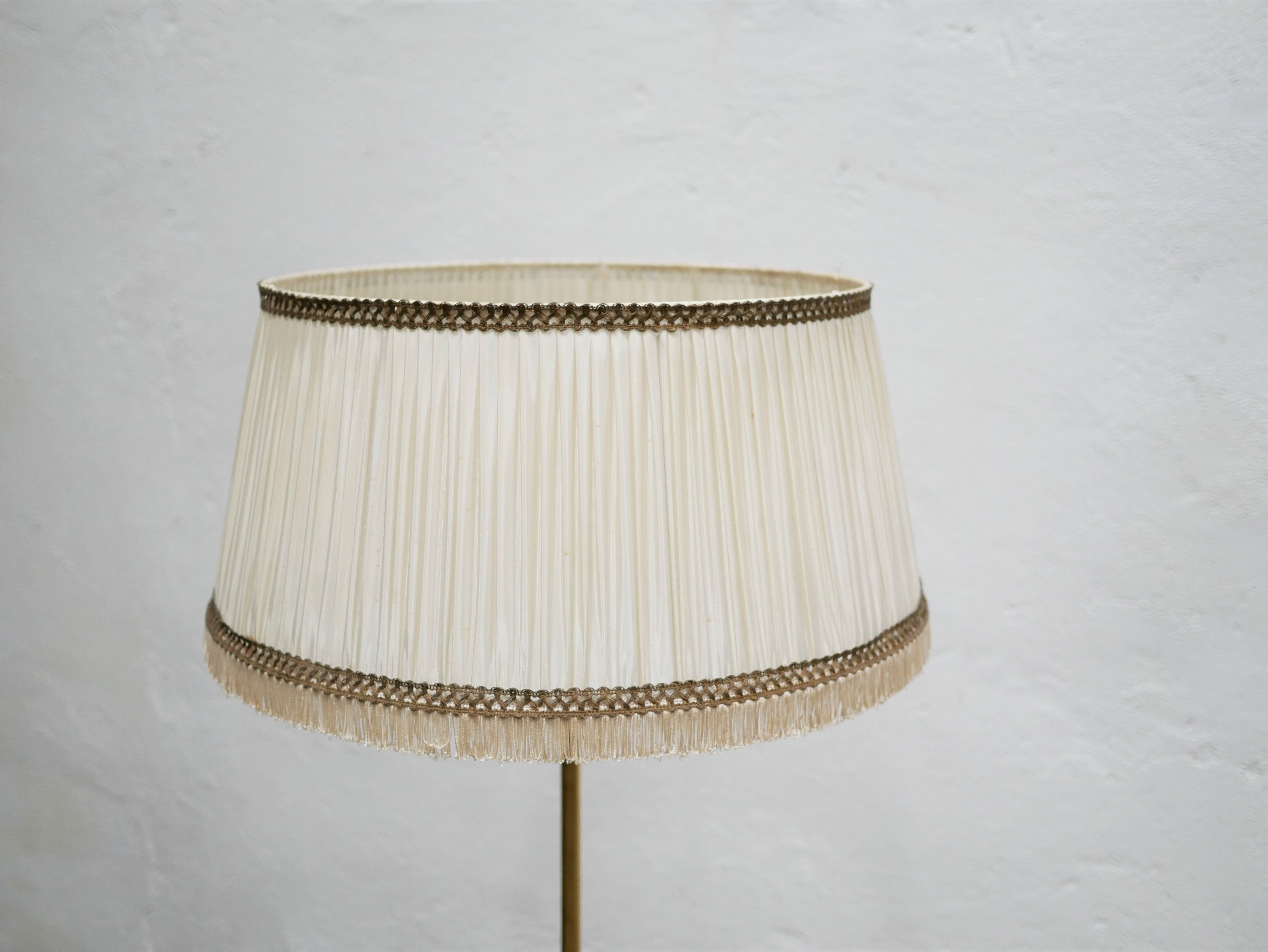 Vintage brass tripod floor lamp