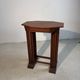Four nesting tables with polygonal tops and decorative inlays.