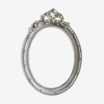 Wooden oval frame with Louis XVI-style knot