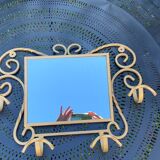 Wall-mounted gilded wrought iron coat rack with mirror